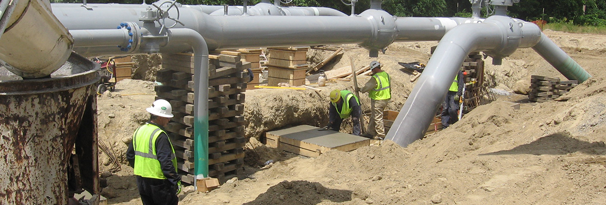 Pouring concrete footings at an industrial location