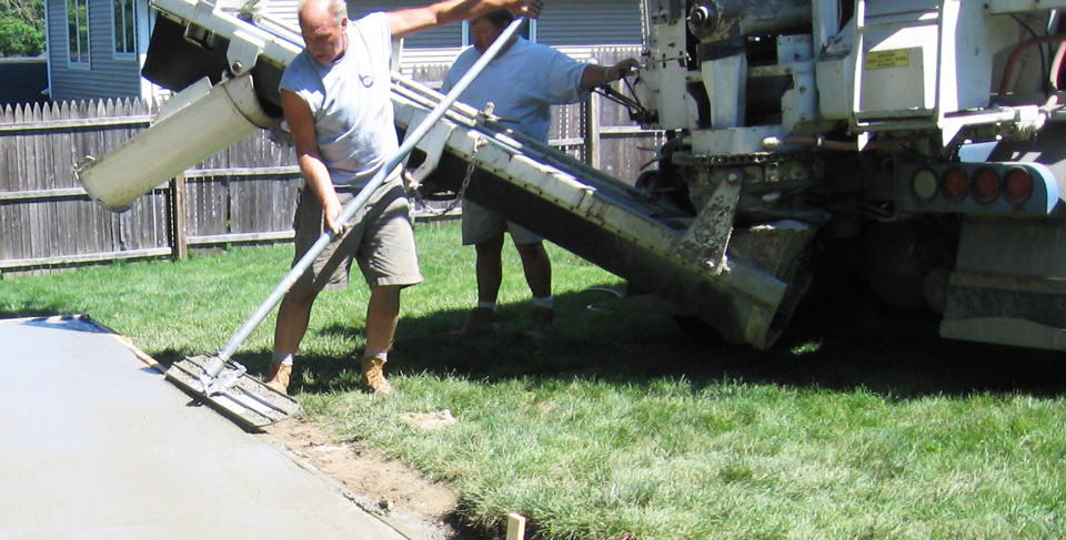 Pouring concrete for an outdoor patio